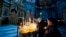Believers light candles during the service for Orthodox Epiphany celebrations in the Nasterea Domnului Cathedral in Chisinau in January.