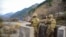 Pakistani soldiers stand guard at a checkpoint in the disputed Kashmir region. (file photo)