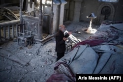 A man prays inside the war-damaged Holy Savior Cathedral in Shusha in October 2020, before the mass exodus from Nagorno-Karabakh of its ethnic Armenian population.