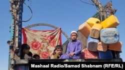 Refugiați afgani expulzați din Pakistan, la punctul de control Chaman, octombrie 2023.