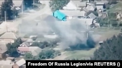 Drone footage released by the Free Russia Legion shows what they claim is the destruction of Russian military targets near Novaya Tavolzhanka in the Belgorod region, Russia, in an image released on June 1.