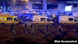 Russia - OMON security forces outside Crocus City Hall where gunmen opened fire at concert - screen grab