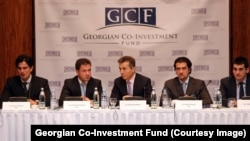 ბიორგი ბაჩიაშვილი (მარცხნიდან მეორე) და ბიძინა ივანიშვილი (შუაში) „თანაინვესტირების ფონდის“ სხვა წარმომადგენლებთან ერთად. 2013 წლის ფოტო