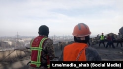 Жылуулук электр борборунда иштеп жаткан адистер. 