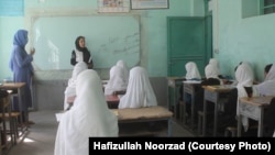 A teacher and students at a class in Farah Province (file photo)