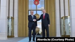 Turkish President Recep Tayyip Erdogan greets his Kazakh counterpart, Qasym-Zhomart Toqaev, in Ankara on May 10. 
