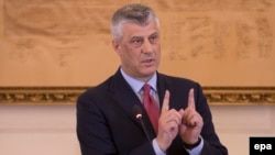 Kosovar President Hashim Thaci gestures during a press conference of his cabinet in Pristina on March 8, 2017.