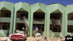FILE: A government complex after a suicide bomb attack in Zabul.