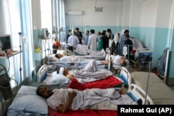 Wounded people receive treatment in a hospital after the blast in Kabul on July 1.