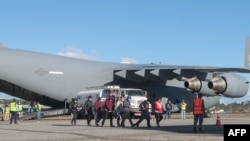 Гватемалалык жарандар АКШдан депортацияланган учур. 