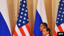 President Dmitry Medvedev (foreground) with U.S. President Barack Obama at the Kremlin
