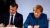 Ангела Меркел и Еманюел Макрон подписват споразумението в Аахен.