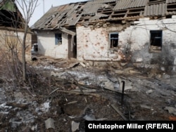 A home sits destroyed after a shell struck it in the morning hours of February 1.