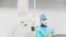 Belarus - Closeup saline intravenous drip. Surgeon is in the operating room on a background. Undated