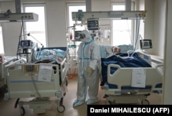 Medical staff attend to COVID-19 patients inside the intensive care unit at the Emergency Institute in Chisinau.