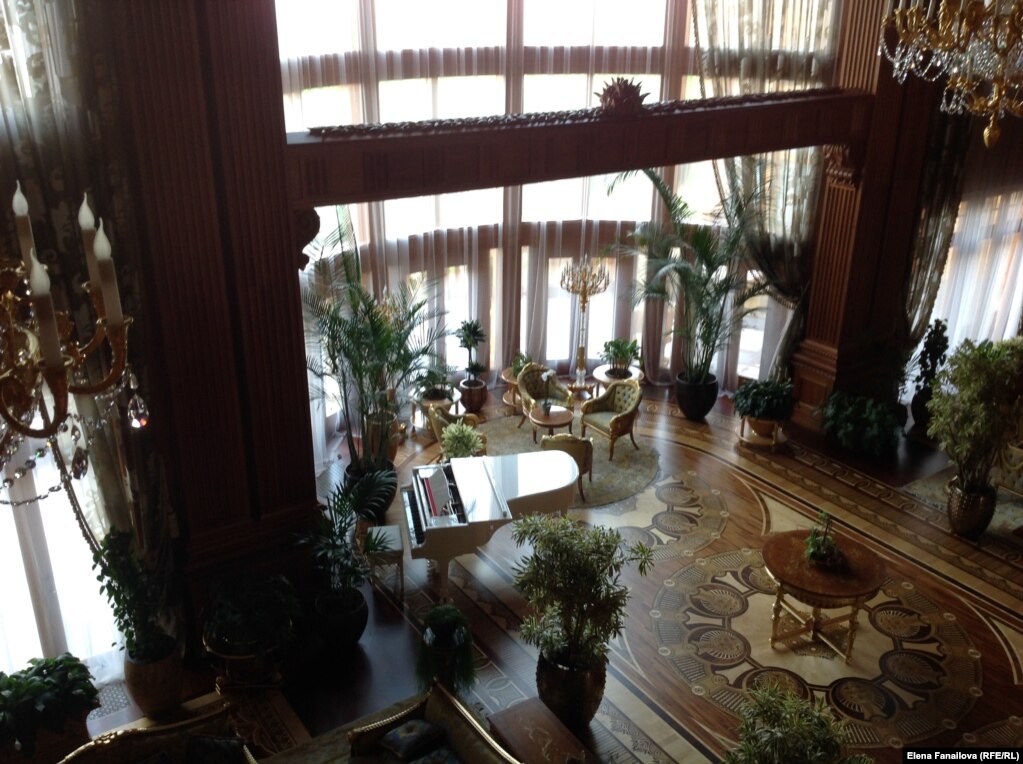 Where would guests have to travel to hear music from this white grand piano?