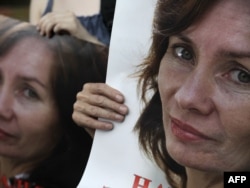 Activists hold portraits of Natalya Estemirova during a rally in Moscow in 2010.
