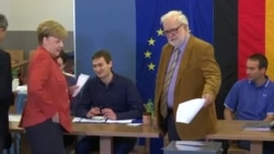 Merkel i Šulc na biralištima