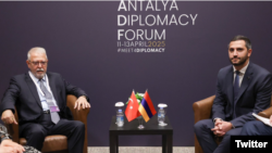 Turkey - Turkish diplomat Serdar Kilic (left) and Armenian parliament vice-speaker Ruben Rubinian meet in Antalya, April 11, 2025.