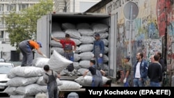 Москвадагы борбор азиялык мигранттар. 2018-жылдын сентябрында тартылган сүрөт. 