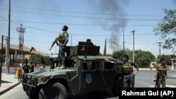 Afghan security forces arrive at the site of a bomb attack in Kabul on July 1. 