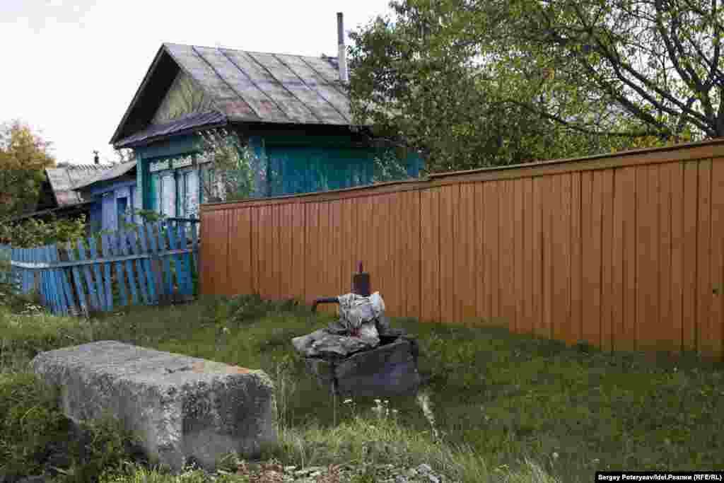 A water pump outside a house. "The authorities prohibited drinking water from local wells but couldn&rsquo;t arrange supplies of clean water. A couple of months later, they took samples and said the local water was good enough to drink," says Ismagilova.