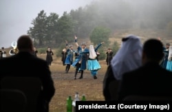 President Ilham Aliyev (left) watches a cultural performance in Susa (known to Armenians as Shushi) in September 2025.