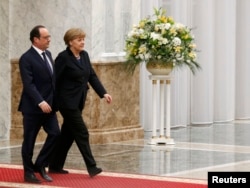 Канцлер Німеччини Ангела Меркель та президент Франції Франсуа Олланд на зустрічі у «нормандському форматі». Мінськ, 11 лютого 2015 року in Minsk, February 11, 2015