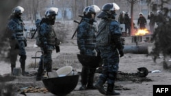 Riot police on patrol in the town of Zhanaozen in western Kazakhstan