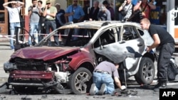 Поліцейські працюють на місці загибелі Павла Шеремета, 20 липня 2016 року