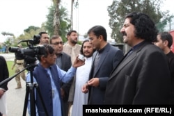 Mohsin Dawar (left), accompanied by Wazir, talks to a Radio Mashaal reporter on March 2020.