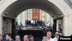 Armenia - People gather outside the Yerevan home of Russian-Armenian businessman Samvel Karapetian, June 17, 2025.