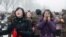 North Korea -- Mourners react as a car Kim Jong-Il's body passes by during the funeral procession in Pyongyang, 28Dec2011
