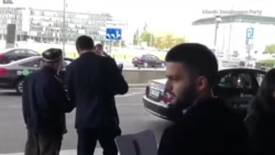 Punches Thrown As Tajik Officials, Activists Scuffle In Poland