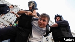 The authorities seemed to pay particular attention to young people, such as this teen who was detained by police in Moscow on September 9.