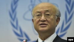 یوکیو آمانو، مدیر کل آژانس بین‌المللی انرژی اتمی (در تصویر) برای پاسخ به پرسش‌های نمایندگان کنگره آمریکا، در میانه مرداد ماه به واشینگتن رفته بود