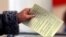 Ukraine - woman casts her ballot during the referendum