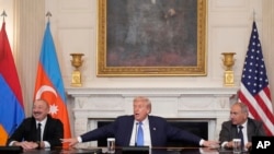 U.S. President Donald Trump, joined by Armenian Prime Minister Nikol Pashinian and Azerbaijan President Ilham Aliyev, speaks during a trilateral signing ceremony at the White House, August 8, 2025.