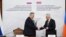 Armenia - Deputy Prime Minister Mher Grigorian (right) and his Russian counterpart Alexei Overchuk sign documents after chairing a meeting in Yerevan, December 17, 2025.