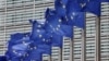 EU flags fly outside the bloc's headquarters in Brussels.