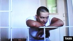 Ukrainian military pilot Nadiya Savchenko is seen on a screen during a video link at a hearing into her appeal at the Voronezh regional court in July.