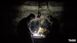 Men play chess during a power cut in Yalta, Crimea, in November.
