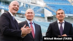 Russian President Vladimir Putin (center), FIFA President Gianni Infantino (left), and Krasnodar Governor Veniamin Kondratyev visit Fisht Stadium, which will host World Cup matches, in Sochi on May 3.