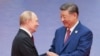 Голова Китаю Сі Цзіньпін (п) і президент Росії Володимир Путін